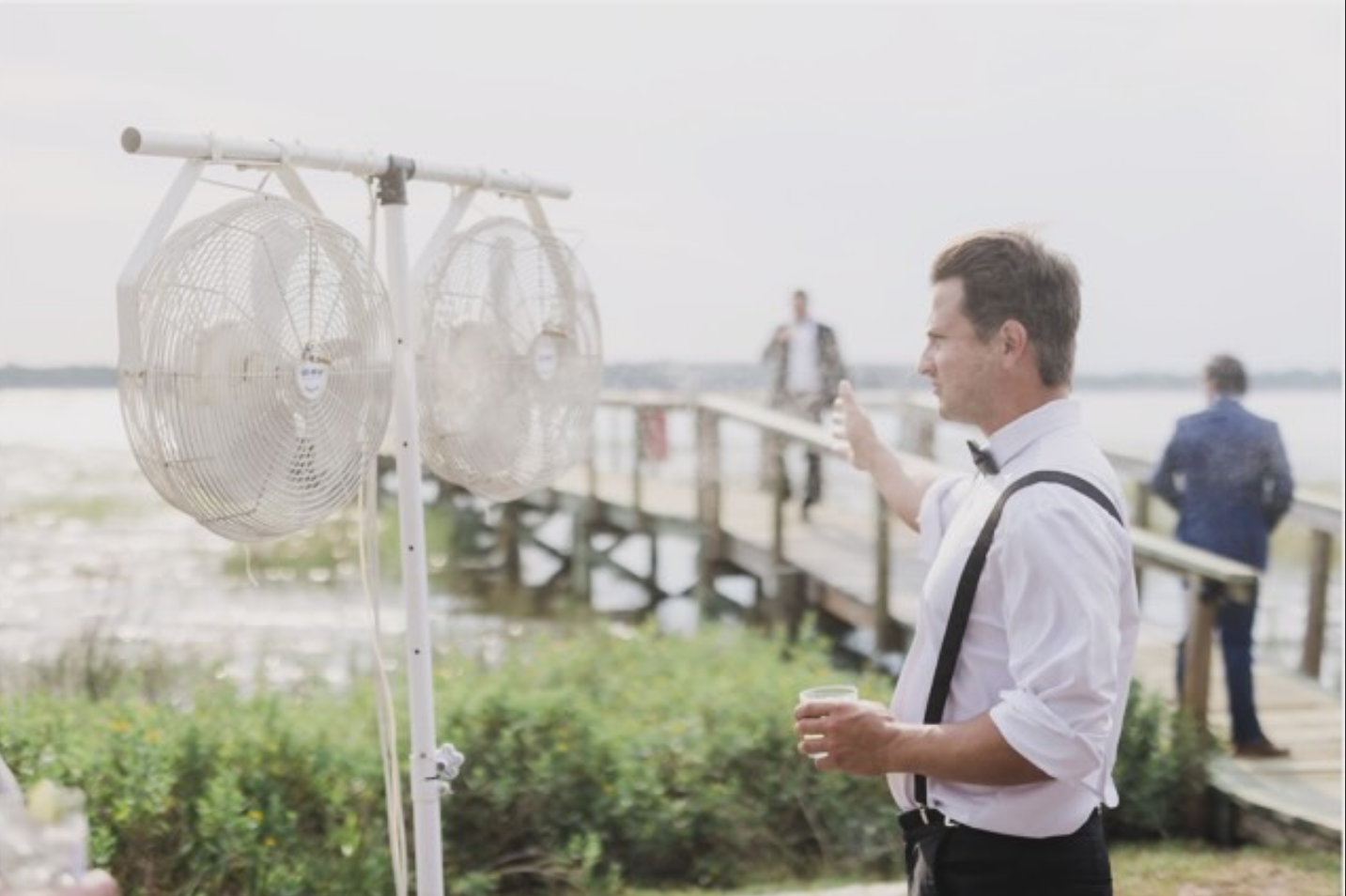 Guests on a dock kept comfortable by All-Mist fans