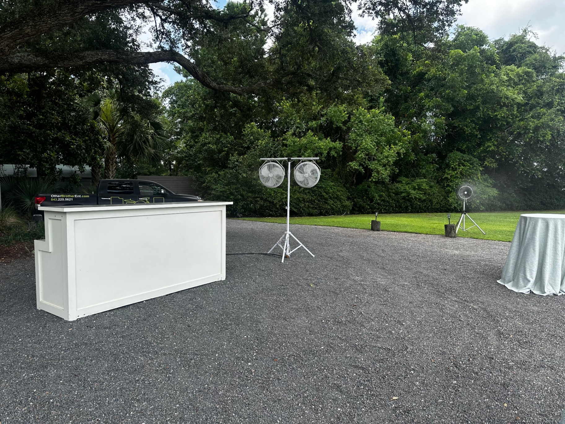 Outdoor bar setup with All-Mist misting fans